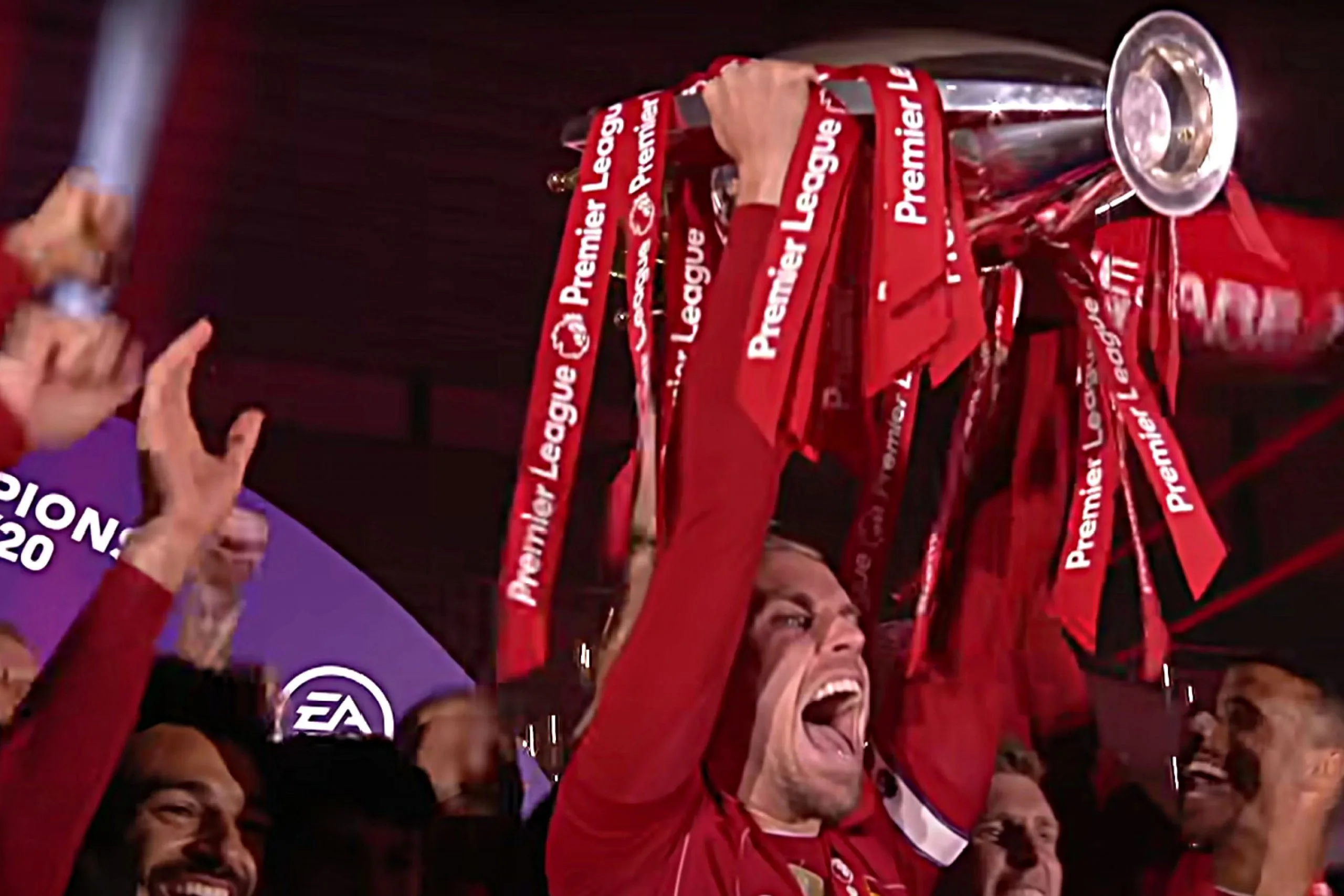 Liverpool captain Jordan Henderson lifting the Premier League trophy