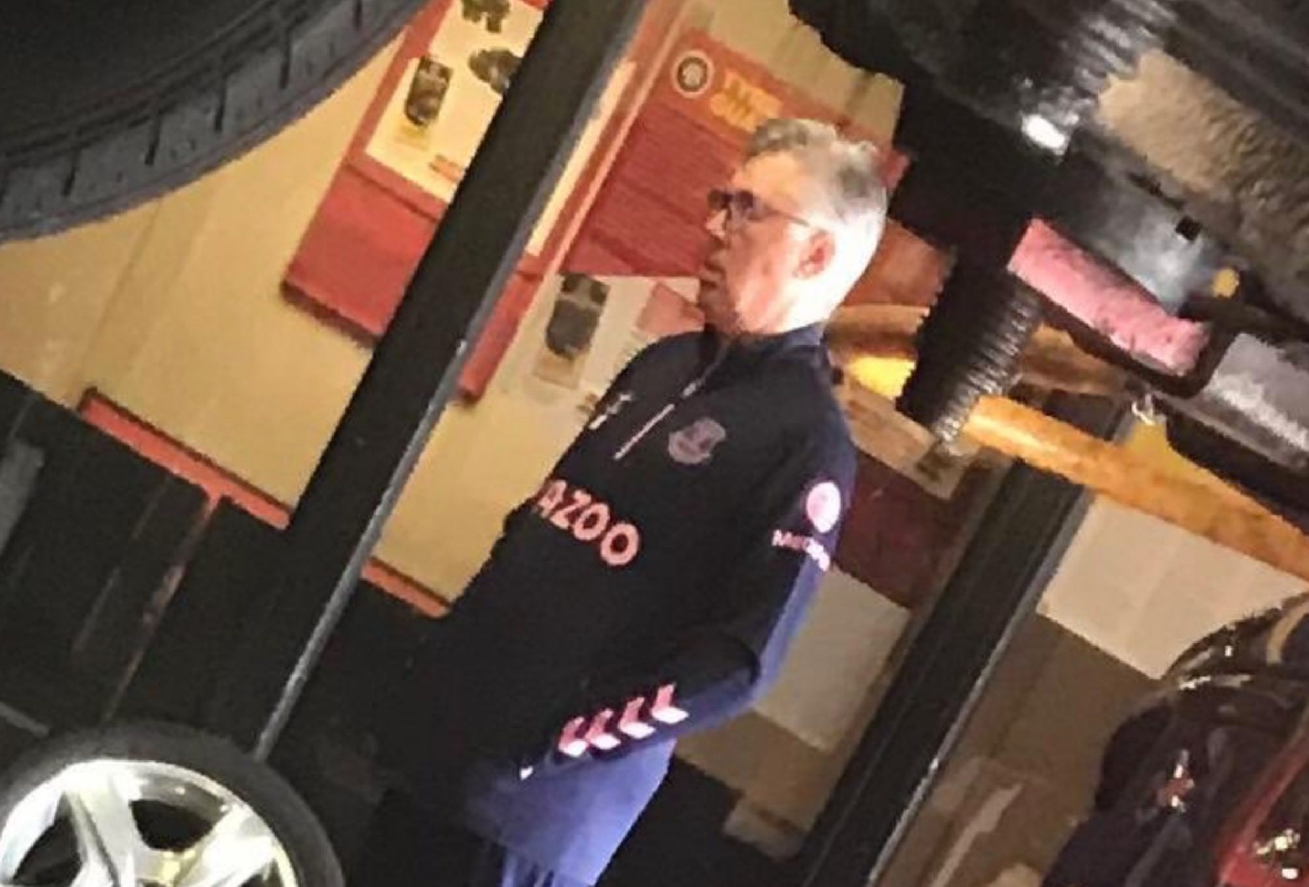 Carlo Ancelotti at a tyre shop