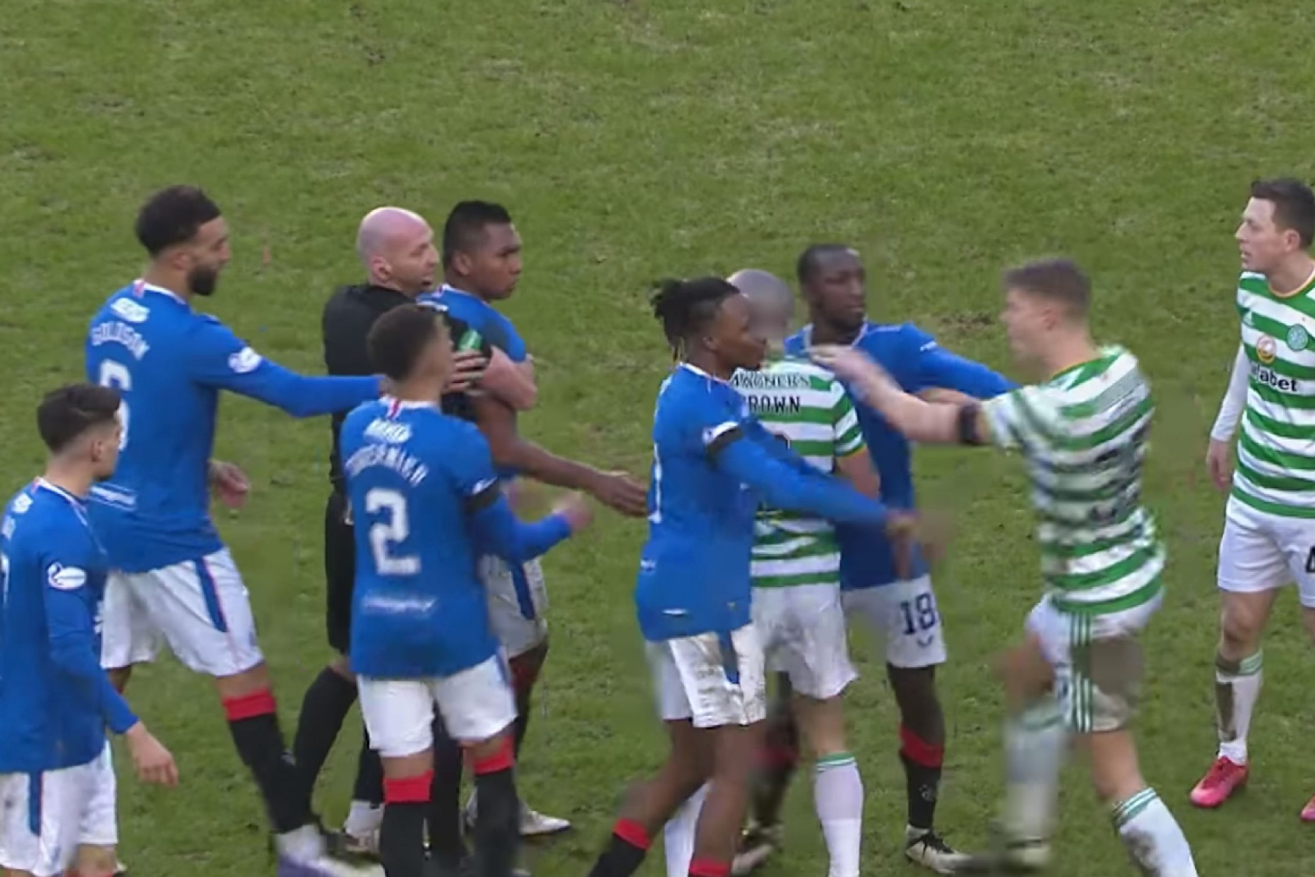 75th minute handbags between Celtic and Rangers as referee Bobby Madden holds Alfredo Morelos back