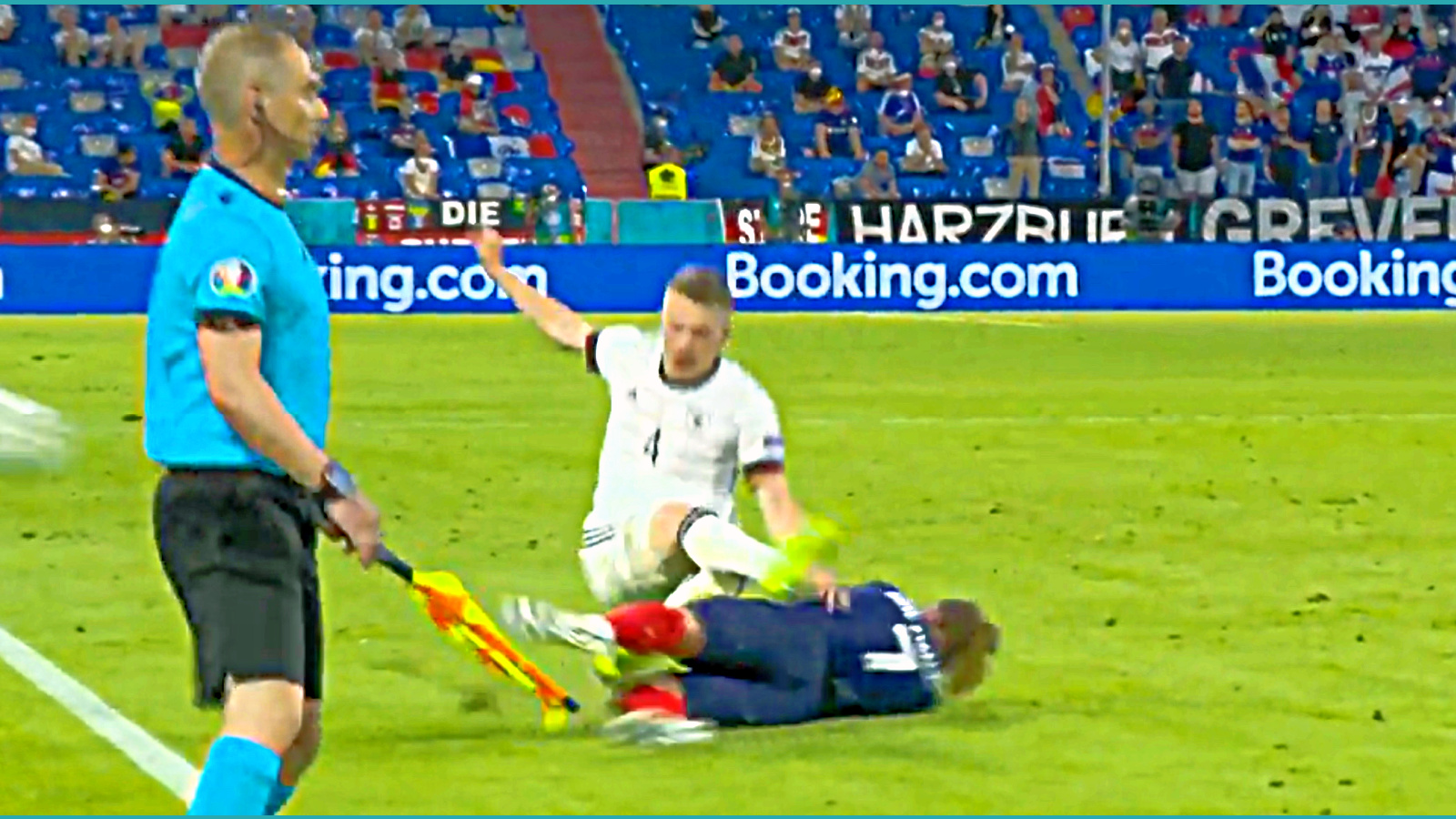 Antoine Griezmann launches a robust tackle on Matthias Ginter during France v Germany