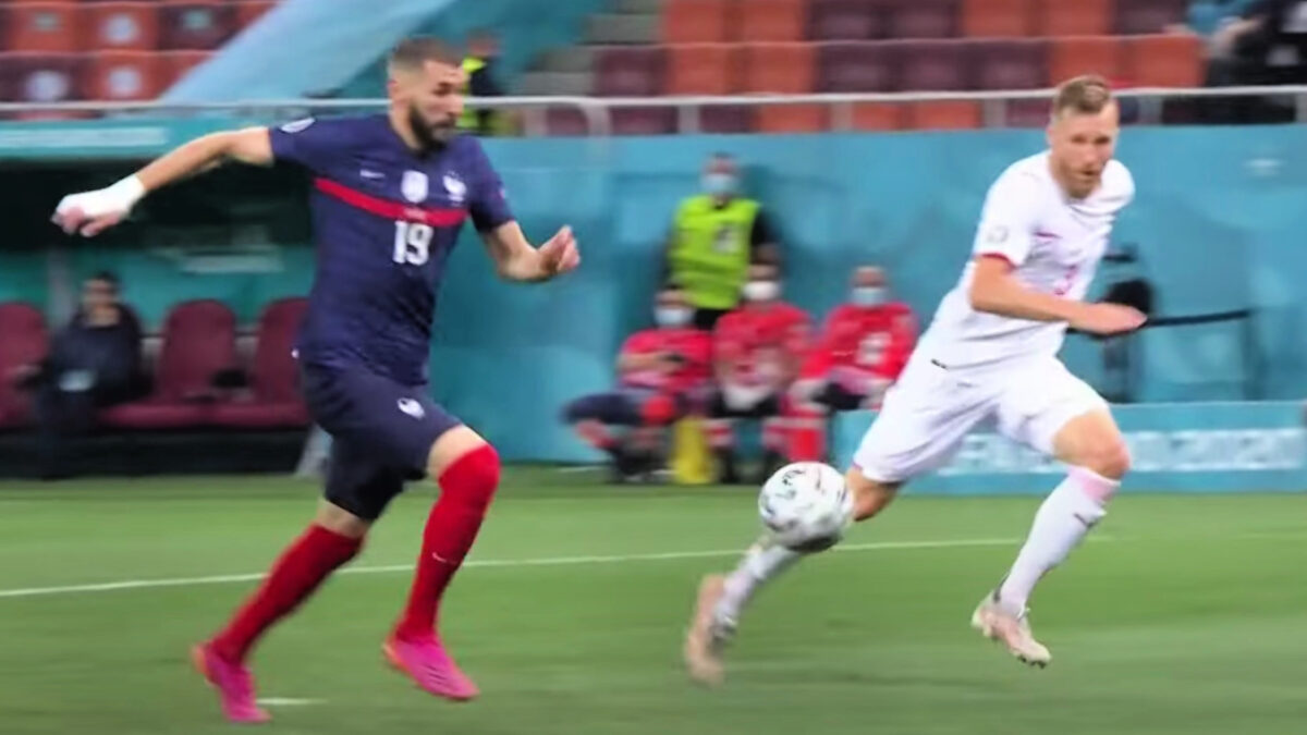 Karim Benzema in his stride before scoring his goal against Switzerland