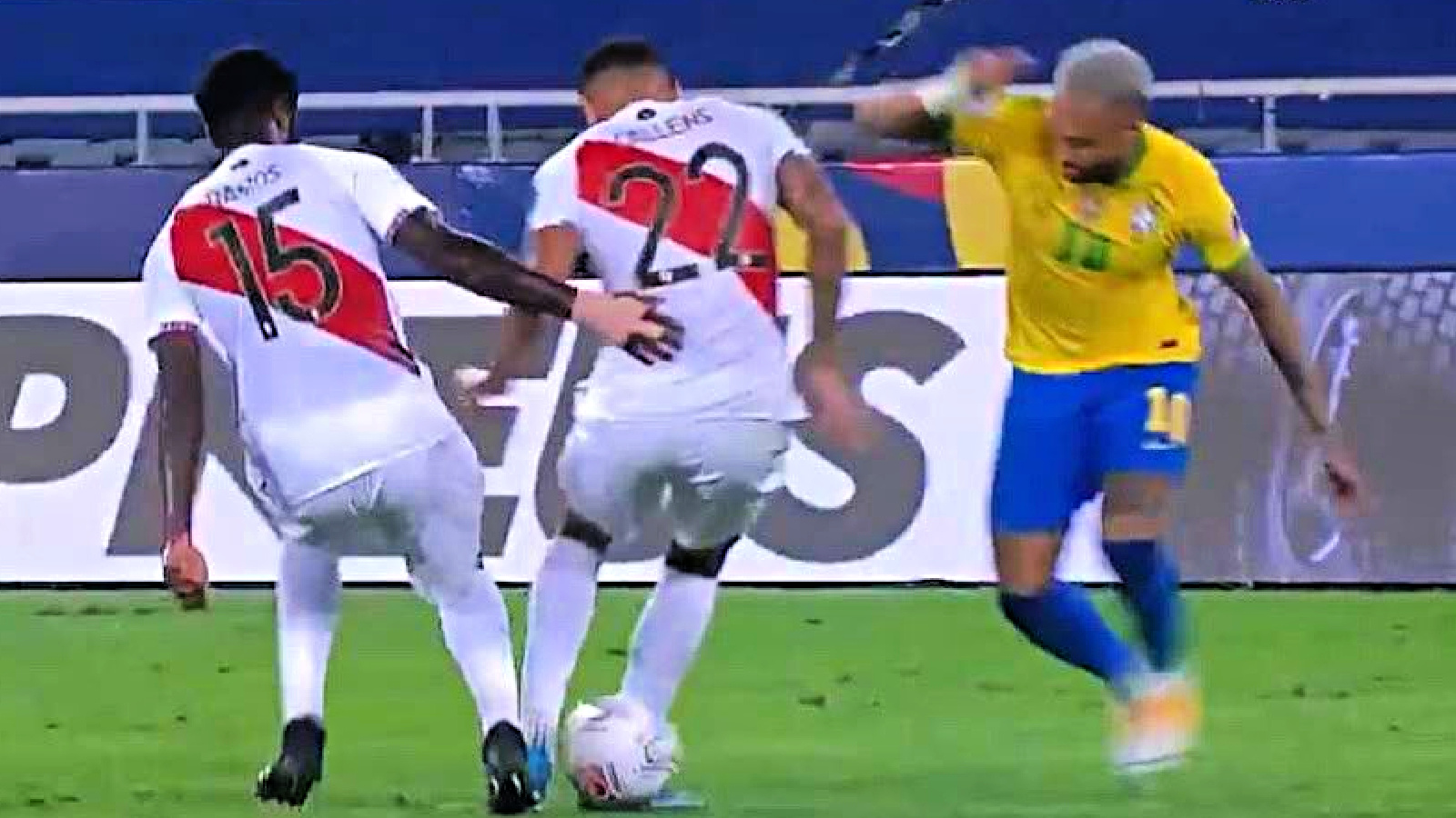 Neymar nutmegs a Peru player before teeing up a pass for Lucas Paqueta