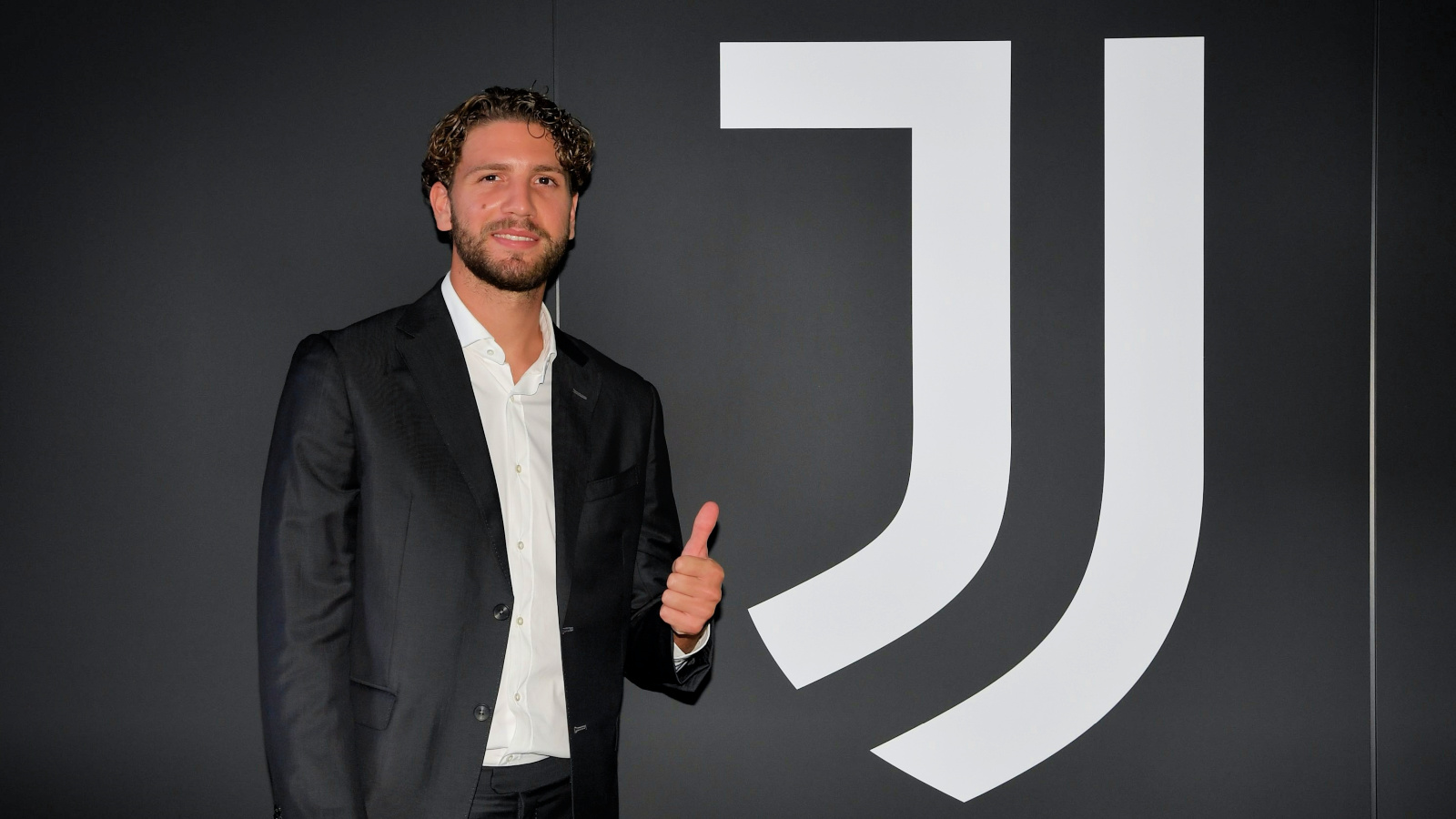 Manuel Locatelli gives a thumbs up after completing his transfer to Juventus