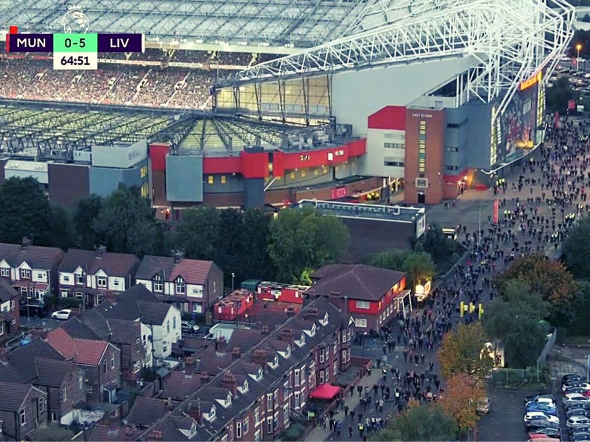 Manchester United fan leaving Old Trafford in the 65th minute against Liverpool