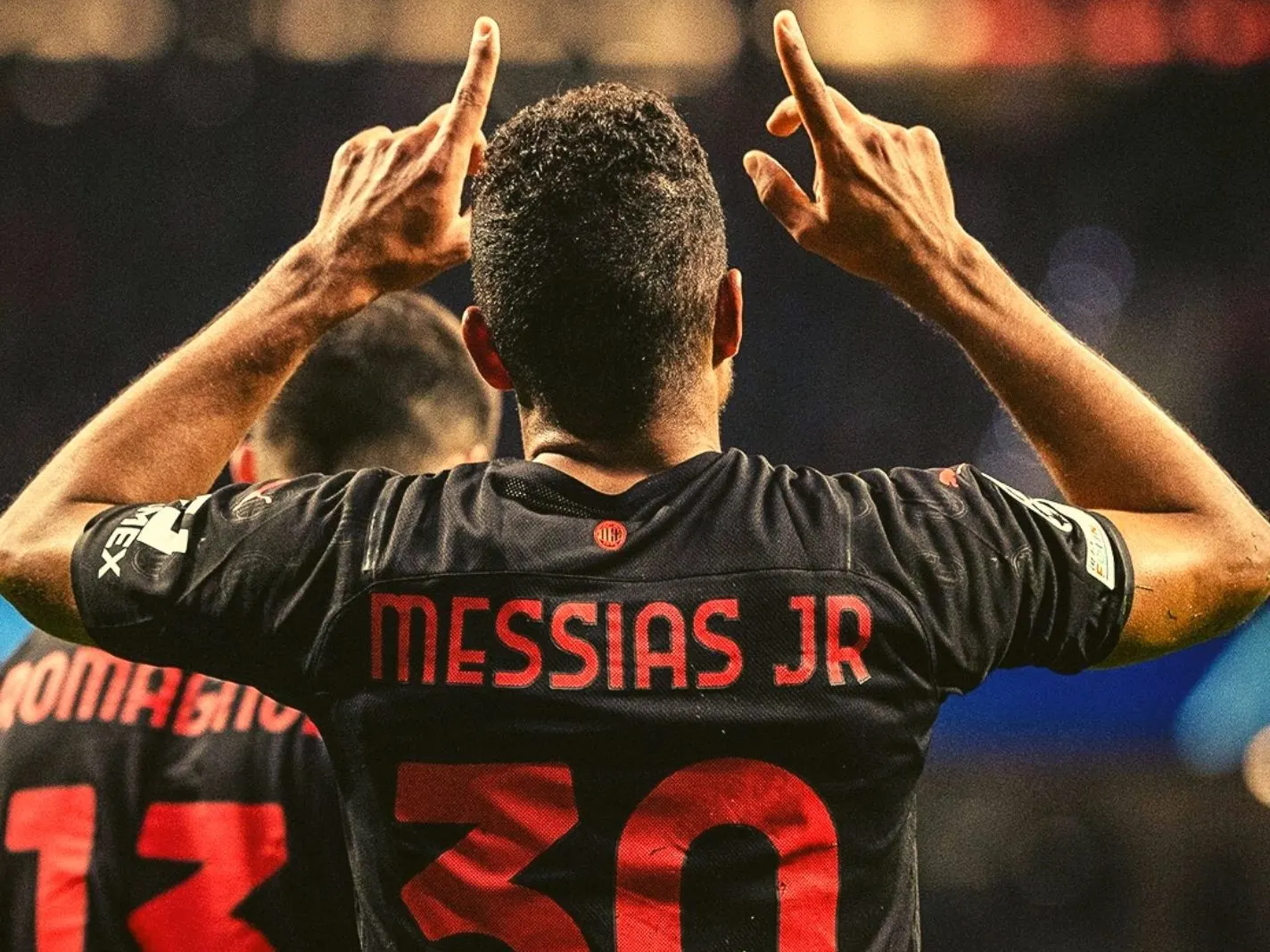 Junior Messias celebrates after scoring a goal against Atletico Madrid