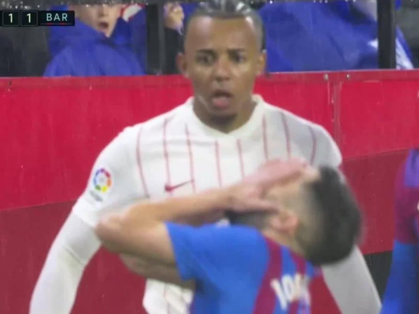 Jules Kounde was sent off for smacking the ball on Jordi Alba's face