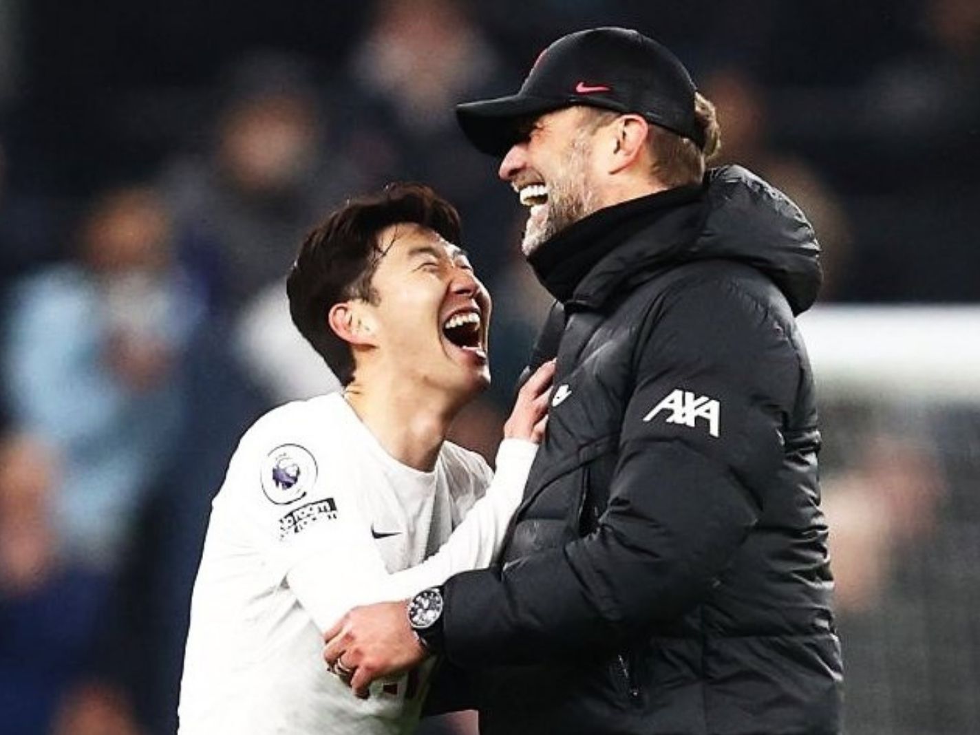 Jurgen Klopp and Son Heung-min smiling together after the final whistle