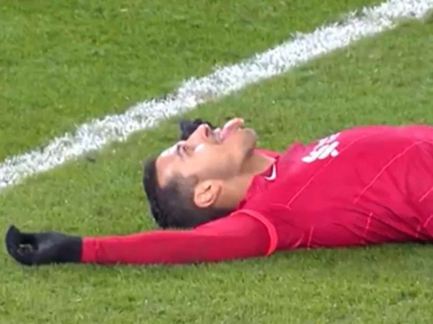 Thiago Alcantara lying on pitch after producing an outrageous overhead kick attempt which nearly went in