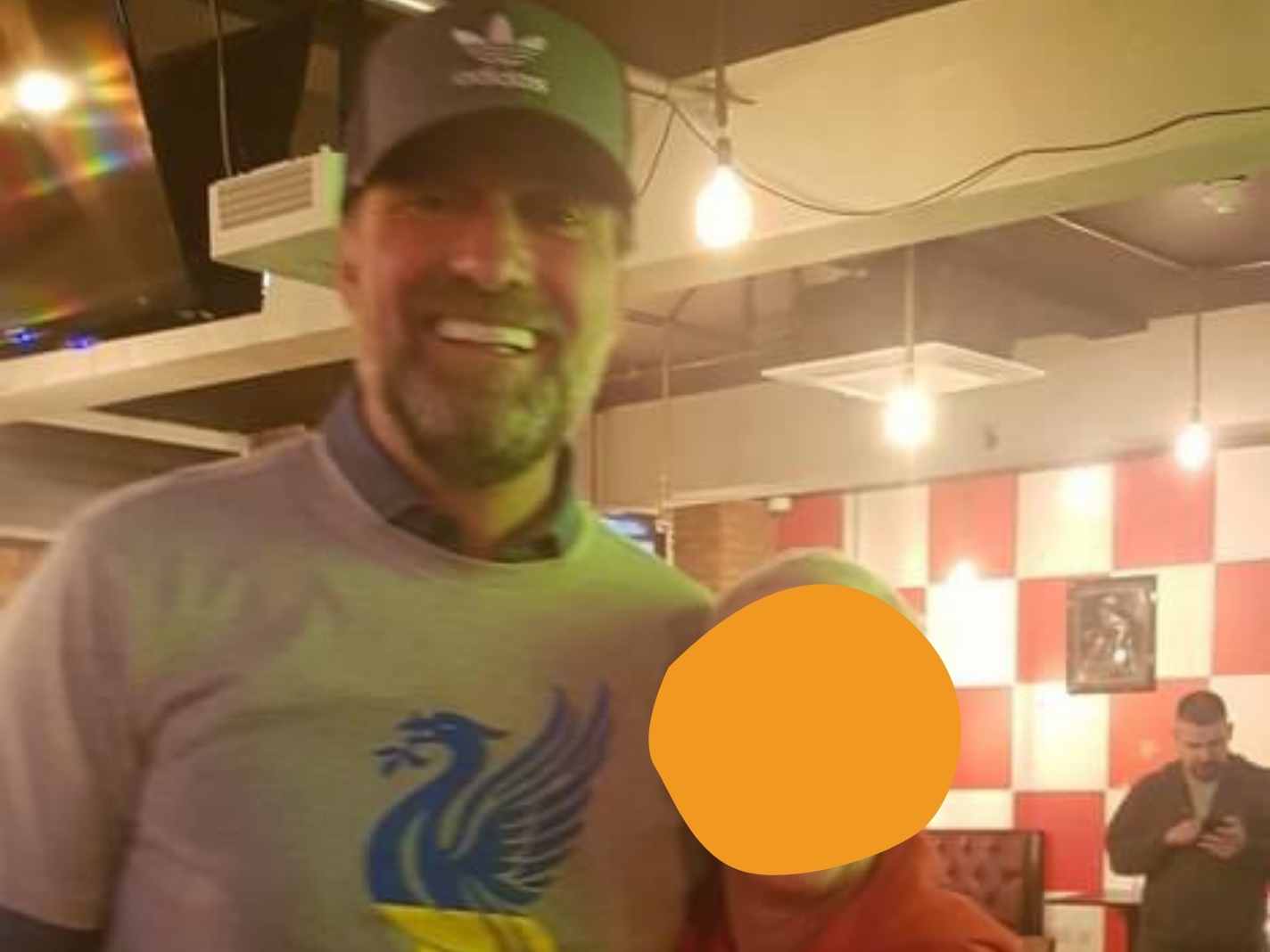 Jurgen Klopp supports Ukraine with custom LFC shirt during visit to local pub