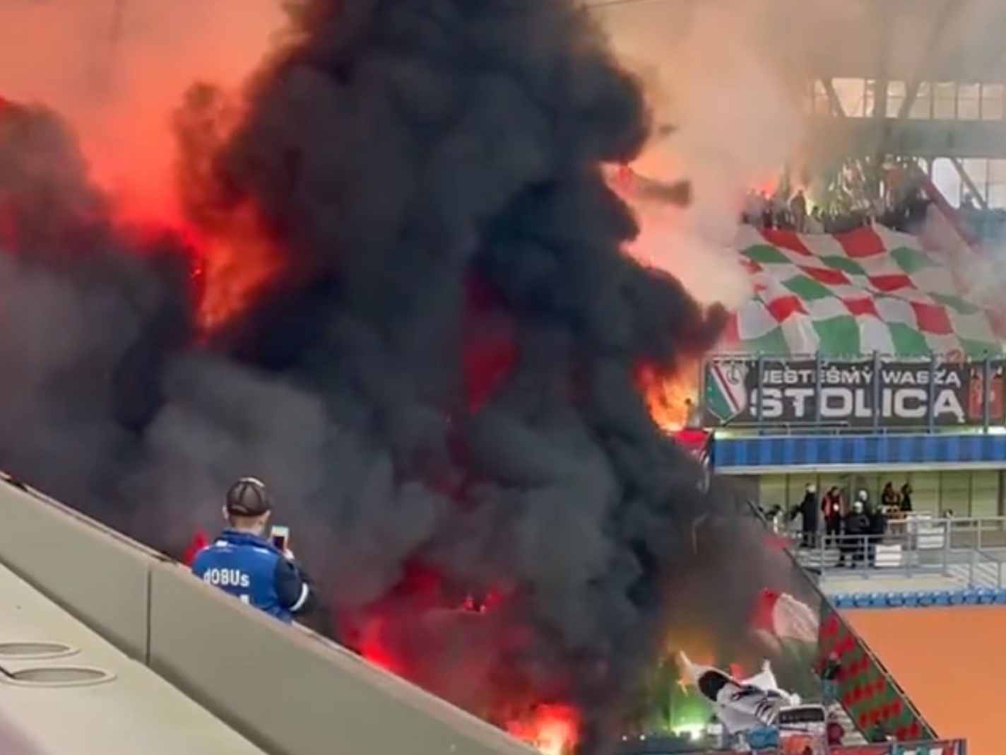 Legia Ultras burn Putin banner