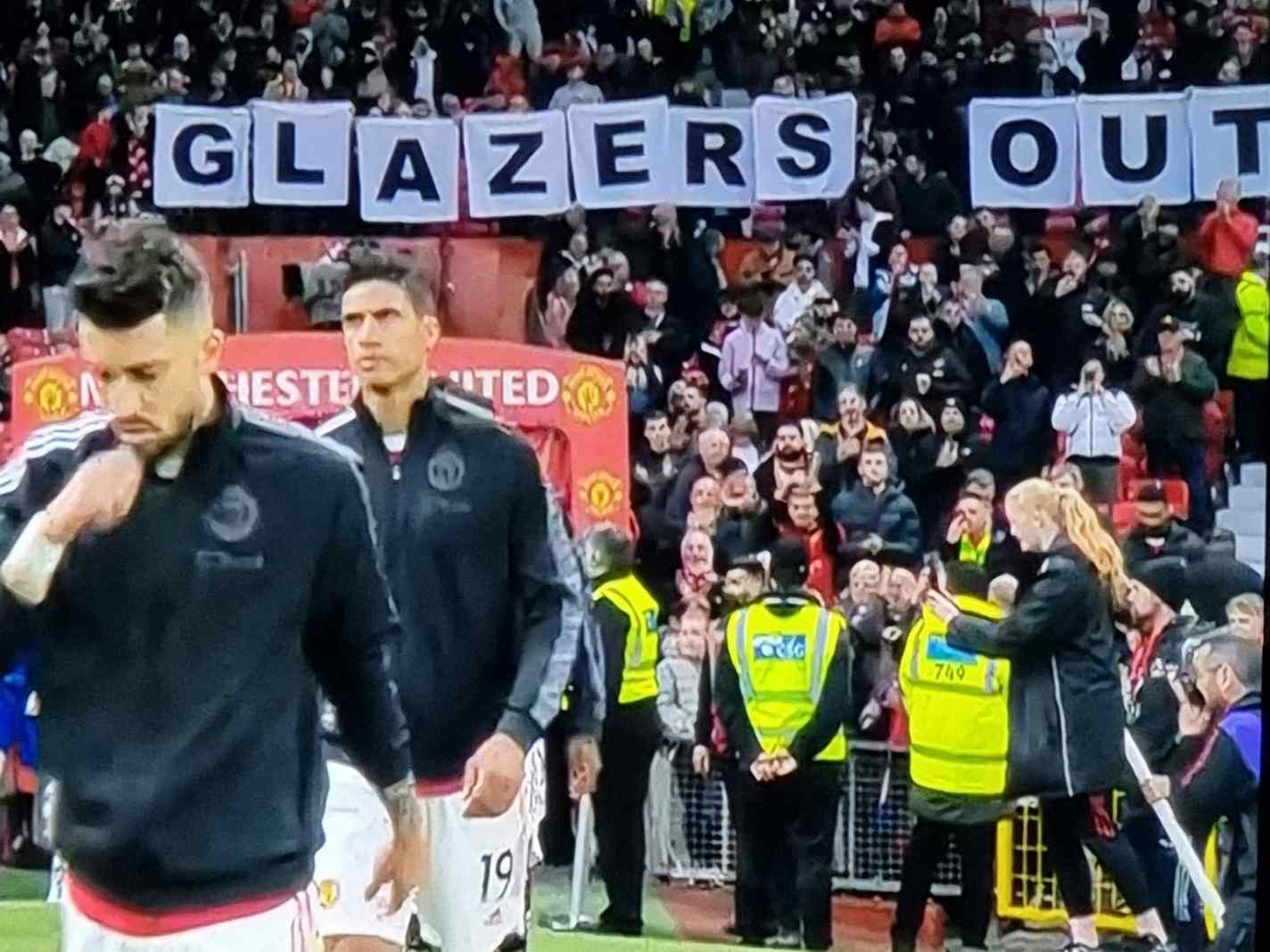 Man Utd fans show Glazers Out banner during Chelsea game
