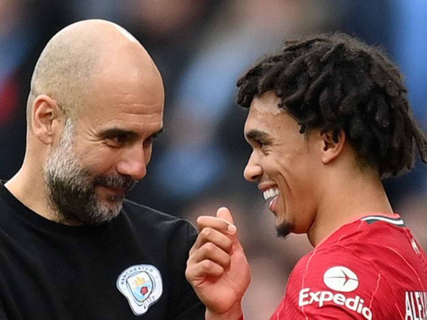 Lovely moment between Liverpool player Trent Alexander Arnold (right) and City gaffer Pep Guardiola