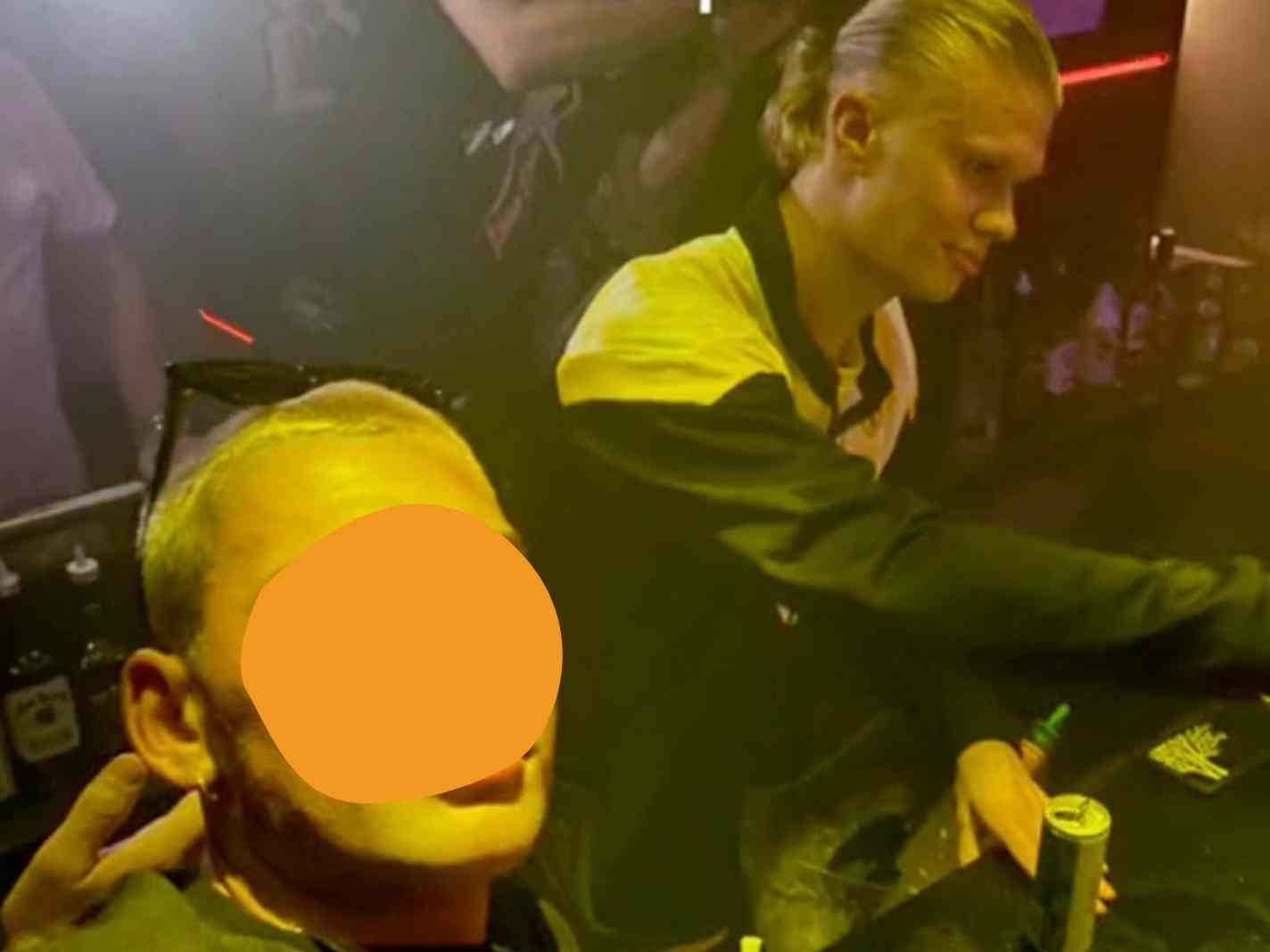 In this image - Erling Haaland (at the back) tending the bar for Borussia Dortmund fans