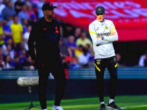 In this image - Jurgen Klopp and Thomas Tuchel standing on the sidelines during the FA Cup final between Liverpool and Chelsea at Wembley.