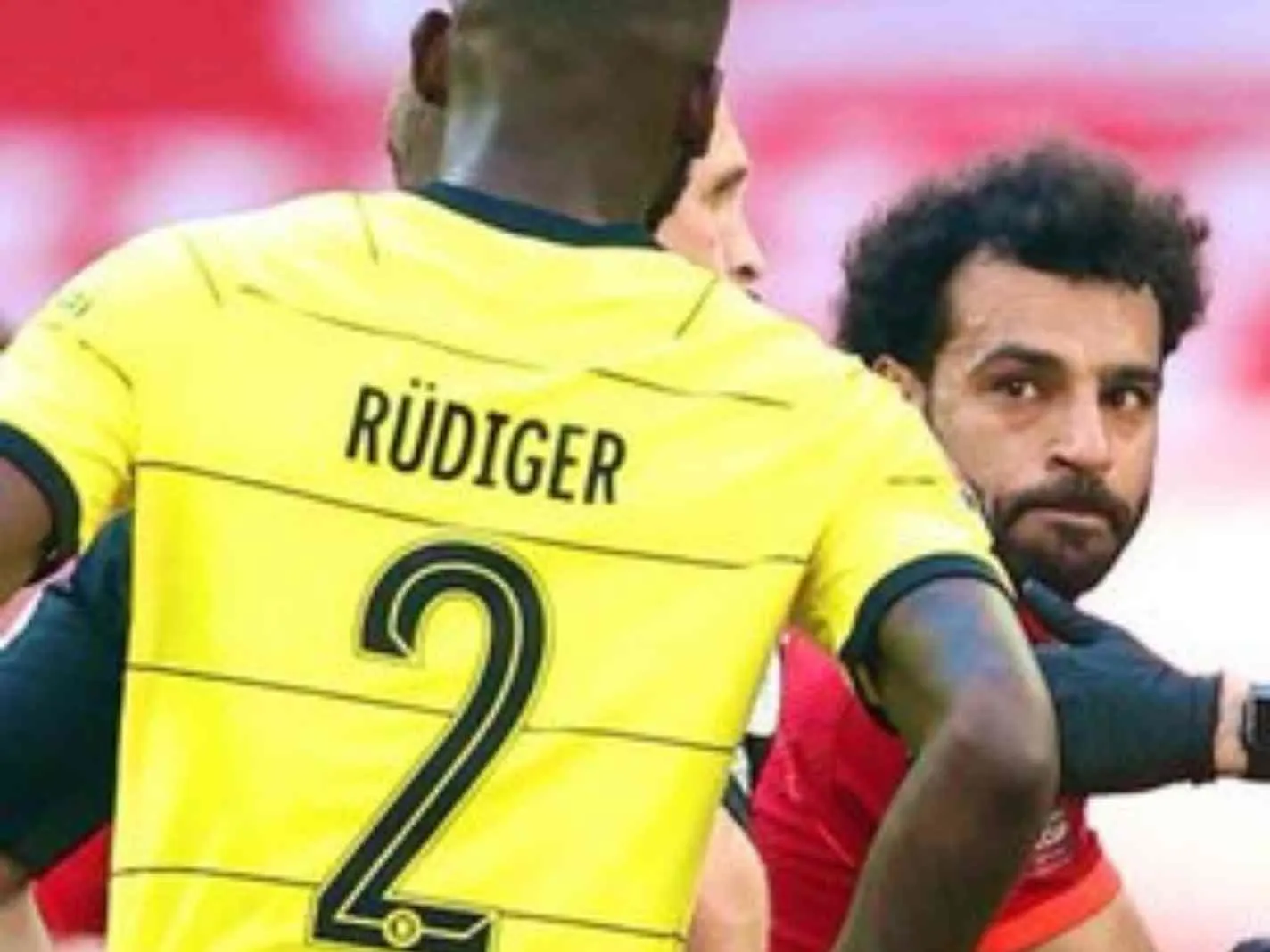 In this image - Mohamed Salah giving Antonio Rudiger a stern look during FA Cup final between Liverpool and Chelsea.