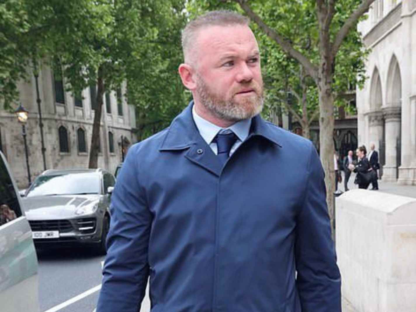 In this image - Wayne Rooney looking the part as he heads to court for wife's libel case.