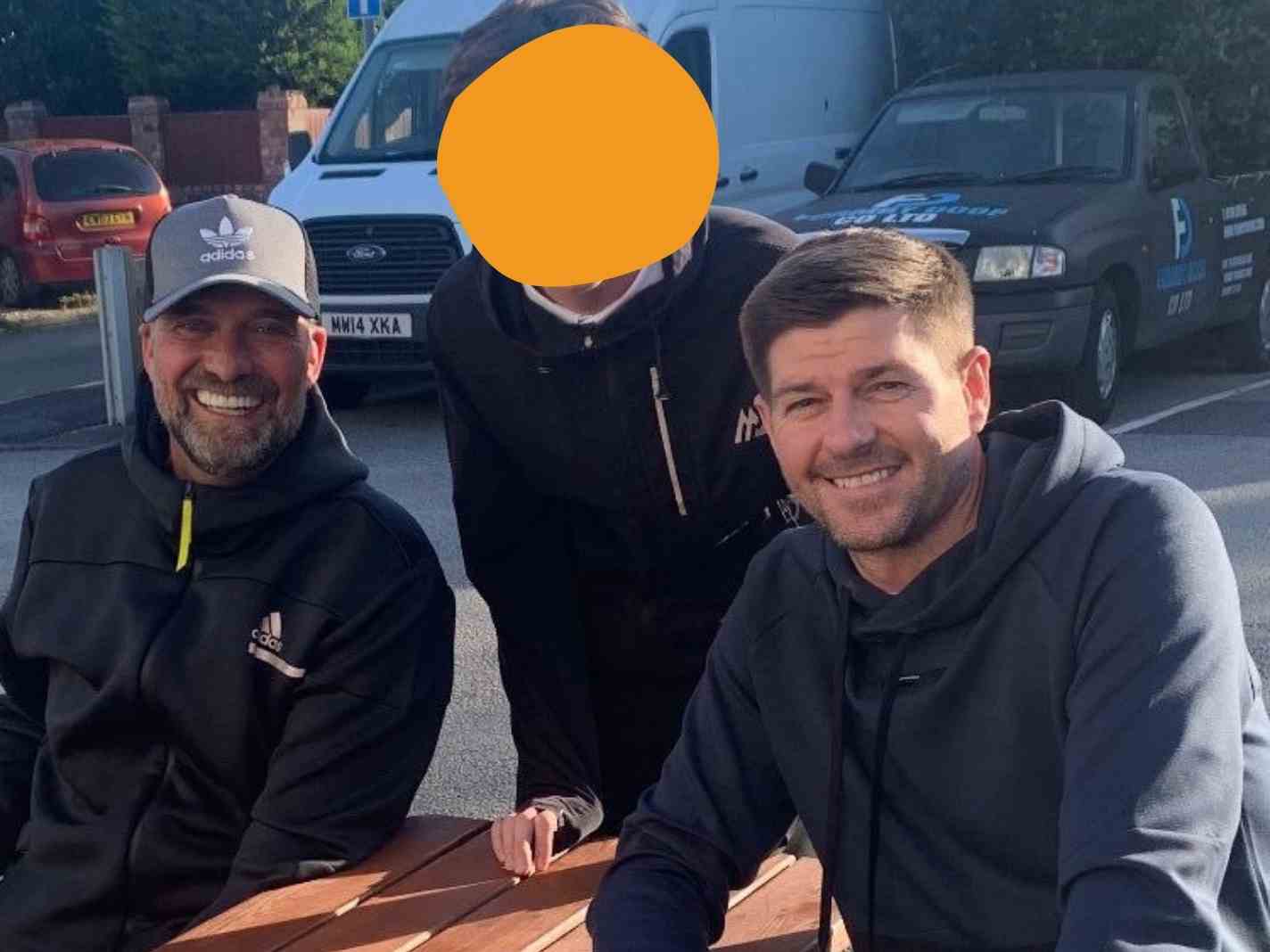 Jurgen Klopp and Steven Gerrard and Liverpool fan at a pub.