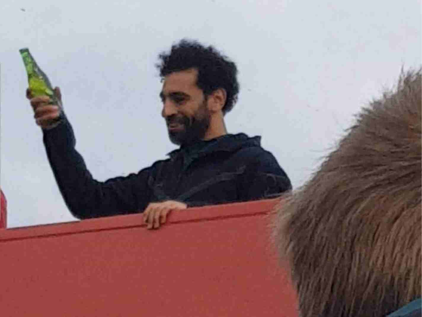 Photo of Mohamed Salah allegedly holding a beer bottle during Liverpool's bus parade.