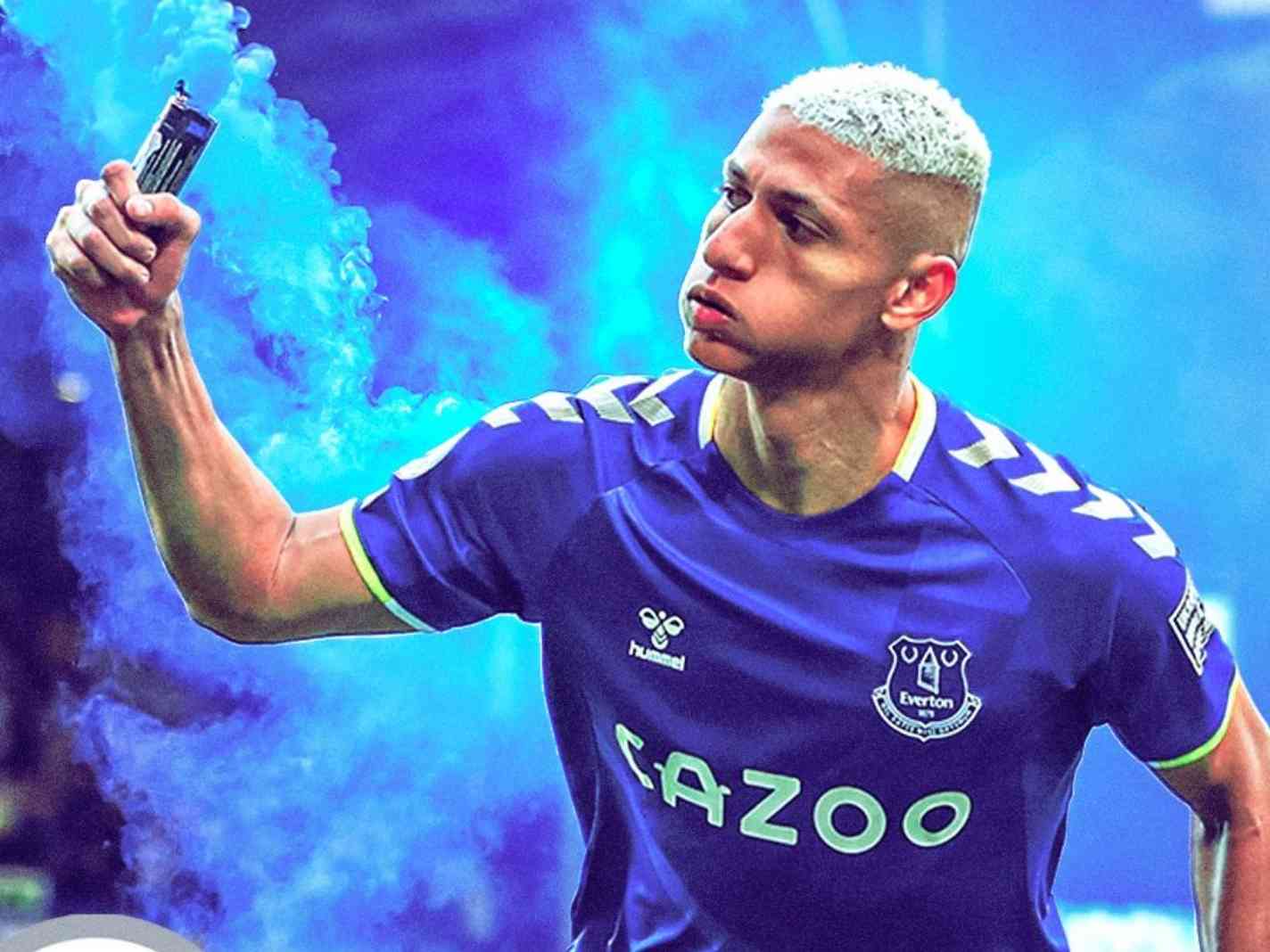Richarlison holding a flare after scoring a goal against Chelsea