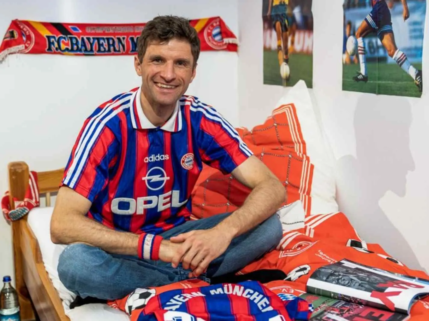 The image shows Thomas Muller recreating his childhood photo with a retro Bayern kit