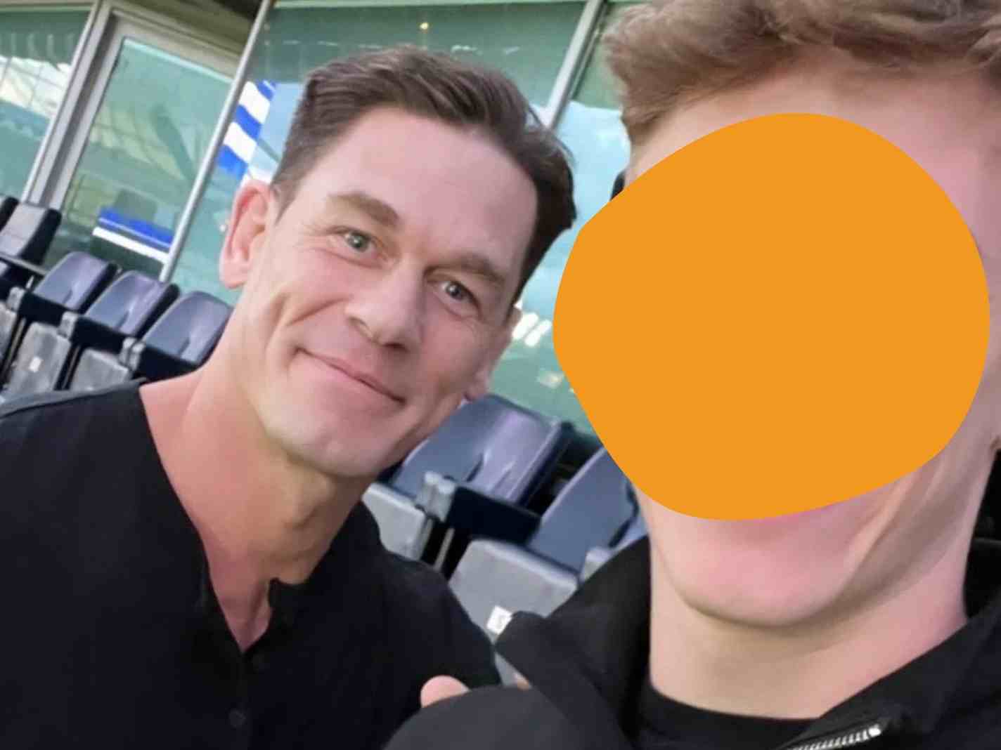 The photo shows John Cena at Stamford Bridge along with a fan.
