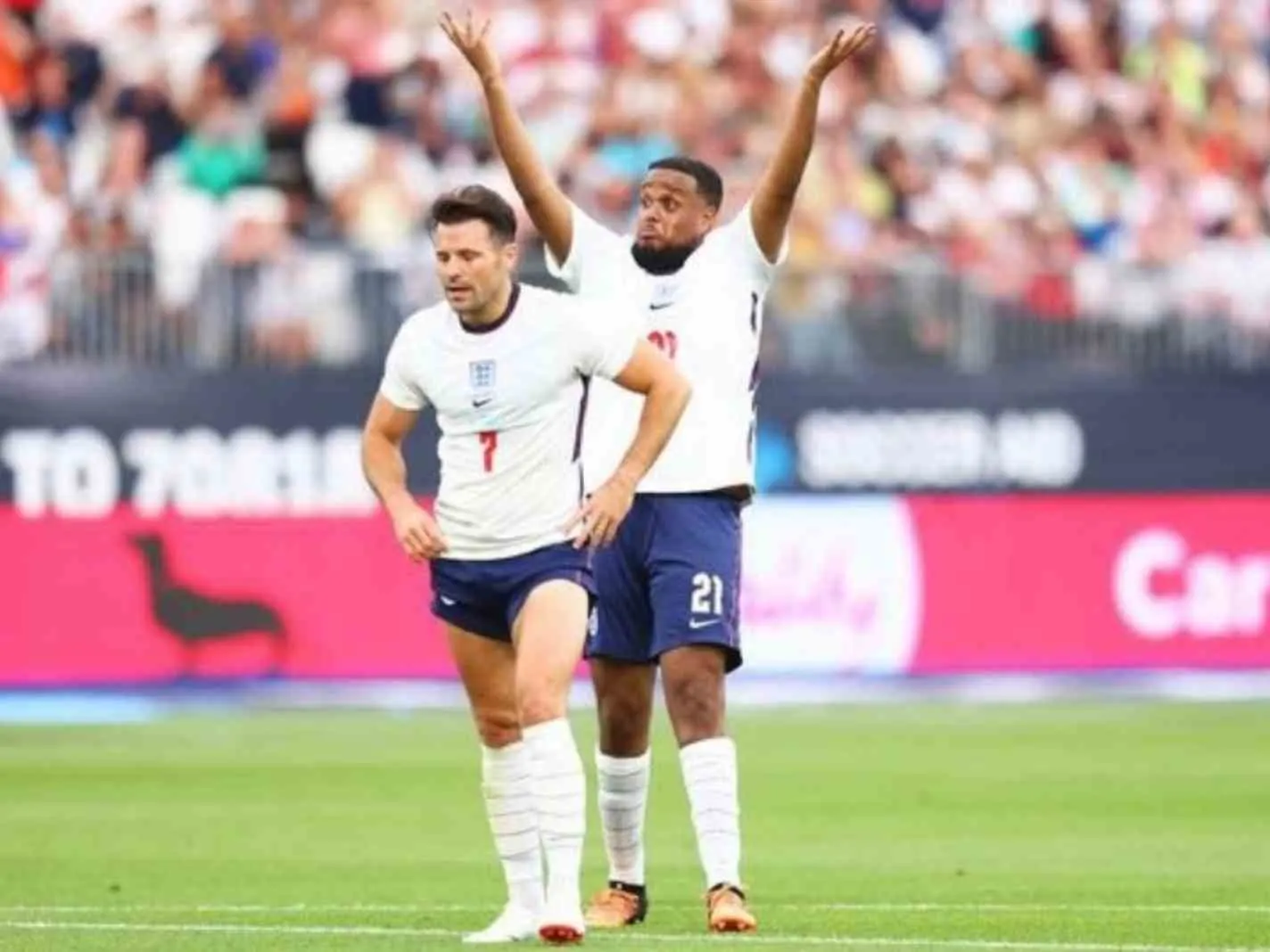 Chunkz (at the back) throws hands up in despair as Mark Wright prepares to take a penalty at Soccer Aid 2022.