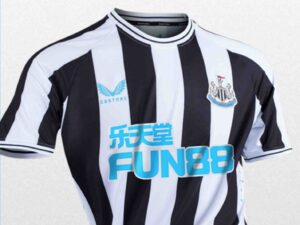 Newcastle United home kit for 2223 season with Fun88 as main sponsor.