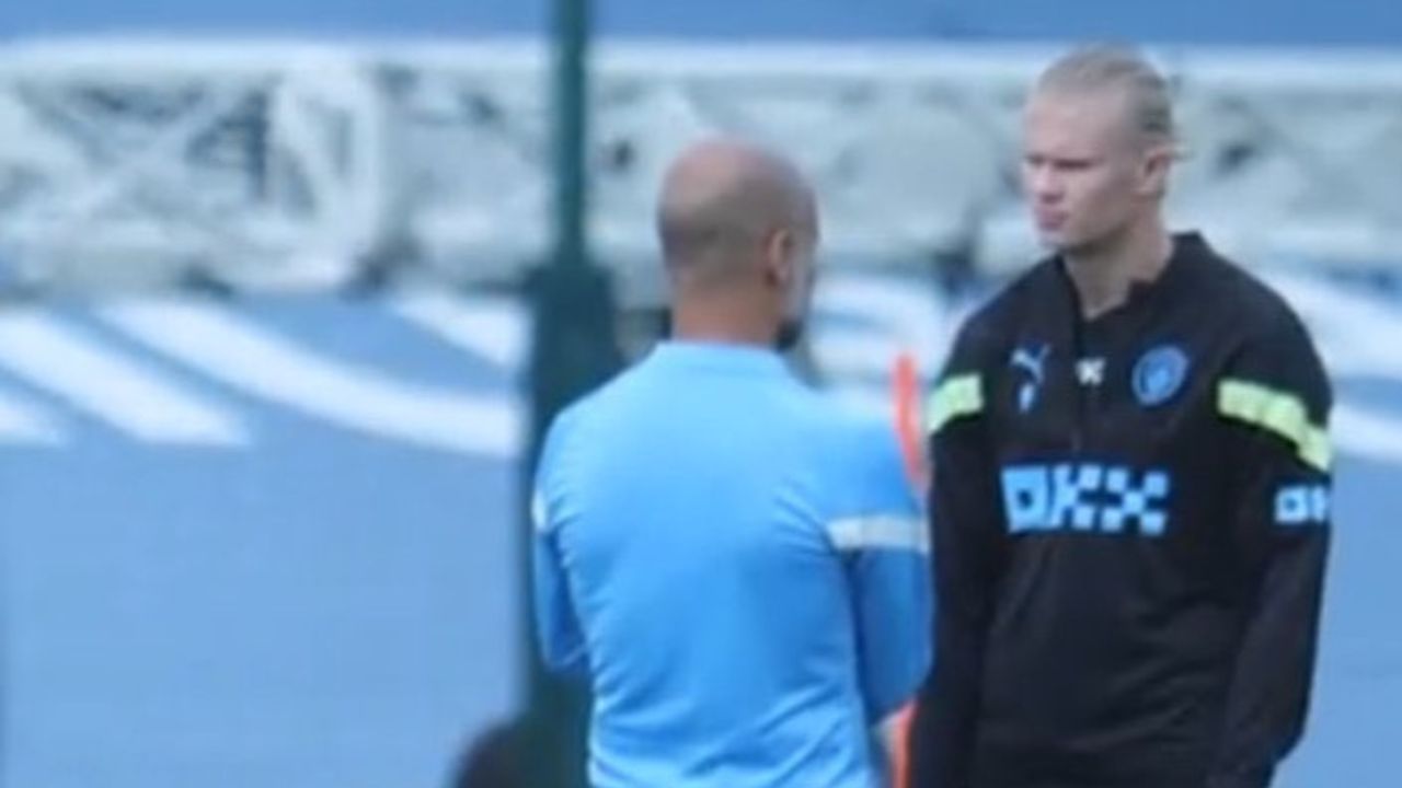Pep Guardiola and Erling Haaland in training