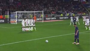 Lionel Messi taking a free kick against Lyon