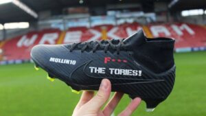 Paul Mullin boots with anti-Tory message