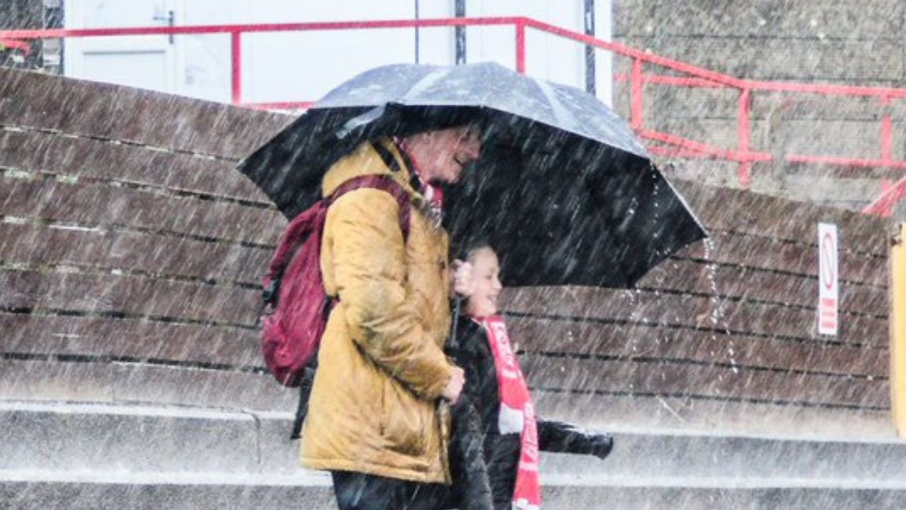 Why This Photo Of Workington Fans Battling the Elements Is So Inspiring