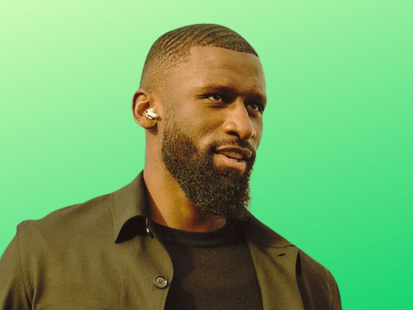 Antonio Rudiger with an airpod and black attire