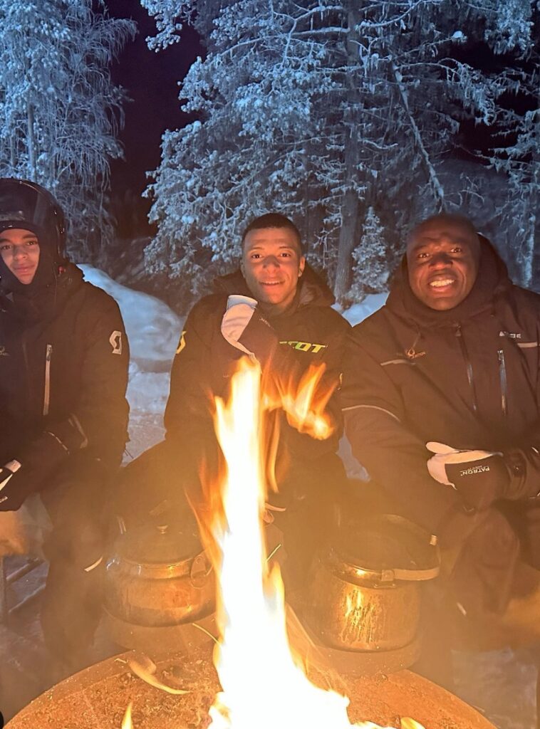 Kylian Mbappe with his father Wilfrid (right) and brother Ethan (left) in FInland