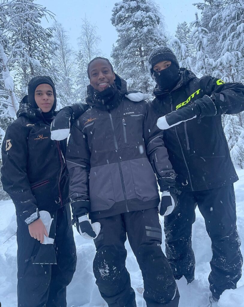 Kylian Mbappe with his friend Brice Tchaga (centre) and brother Ethan (far left) in FInland
