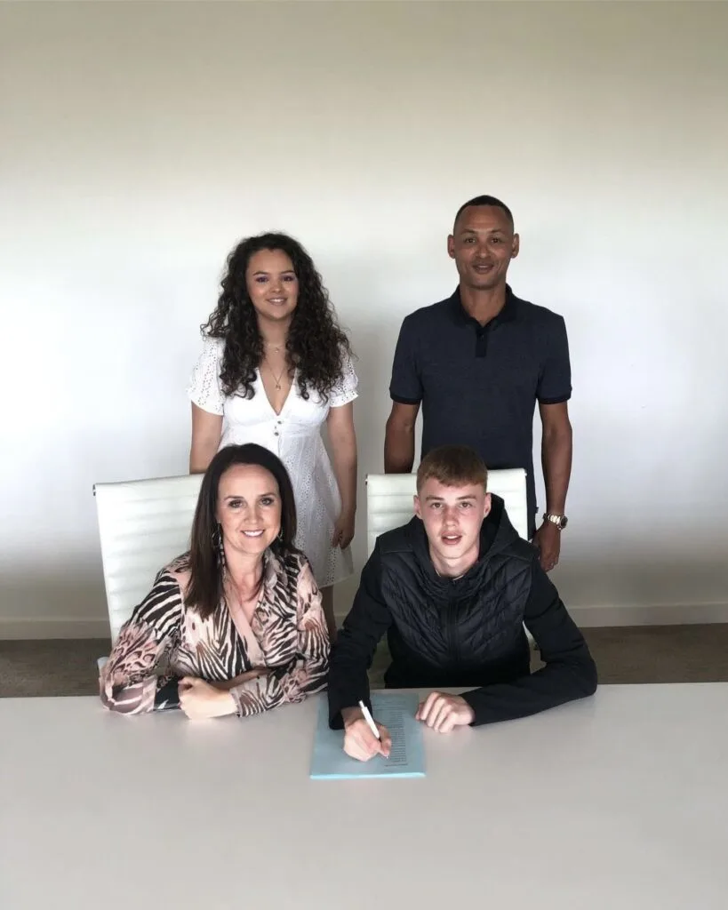 Cole Palmer with his parents and sister when he signed his first professional contract