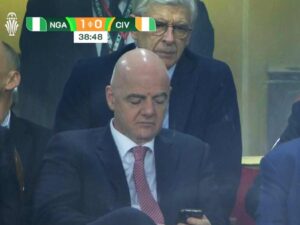 Fans React to Arsene Wenger Snooping at Gianni Infantino’s Phone at AFCON Final