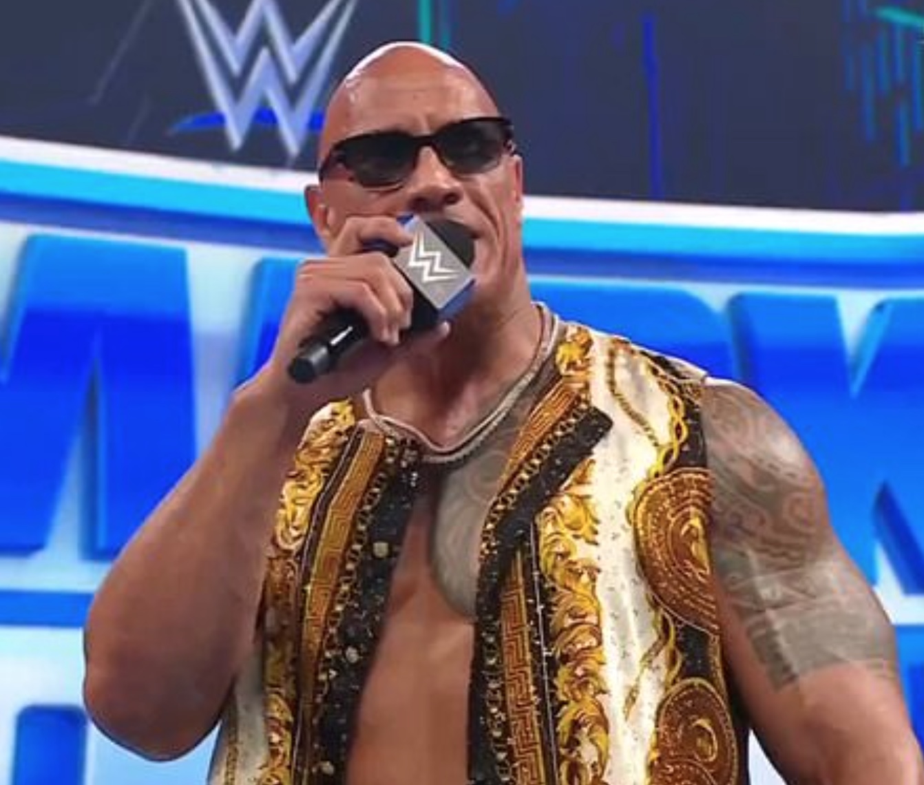 Fans Buzzing Over The Rock’s Bold Versace Look on SmackDown